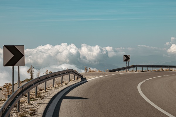 OpenAI Anthropic guardrails containment https://www.pexels.com/photo/barriers-on-the-road-bend-above-the-clouds-19288164/