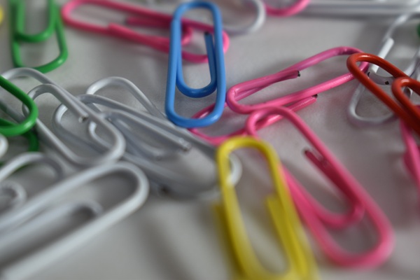 Paperclip AI agent https://www.pexels.com/photo/scattered-colorful-paperclips-5251349/