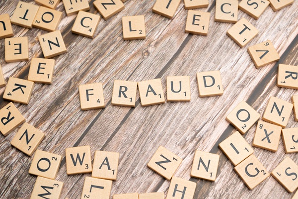 Socure Fravity identity fraud https://www.pexels.com/photo/the-word-fraud-spelled-out-in-scrabble-letters-19835552/