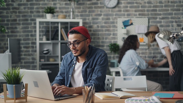 small business AI risk https://www.pexels.com/photo/a-man-in-a-red-hat-is-working-on-his-laptop-23496603/